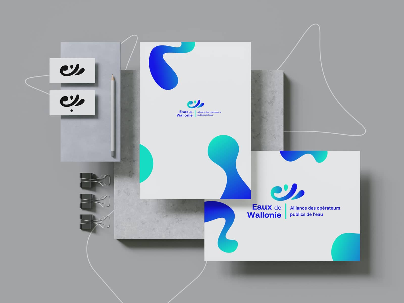 Déclinaison de l'identité visuelle créée par Paper Duck pour Eaux de Wallonie sur différents supports de papeterie
